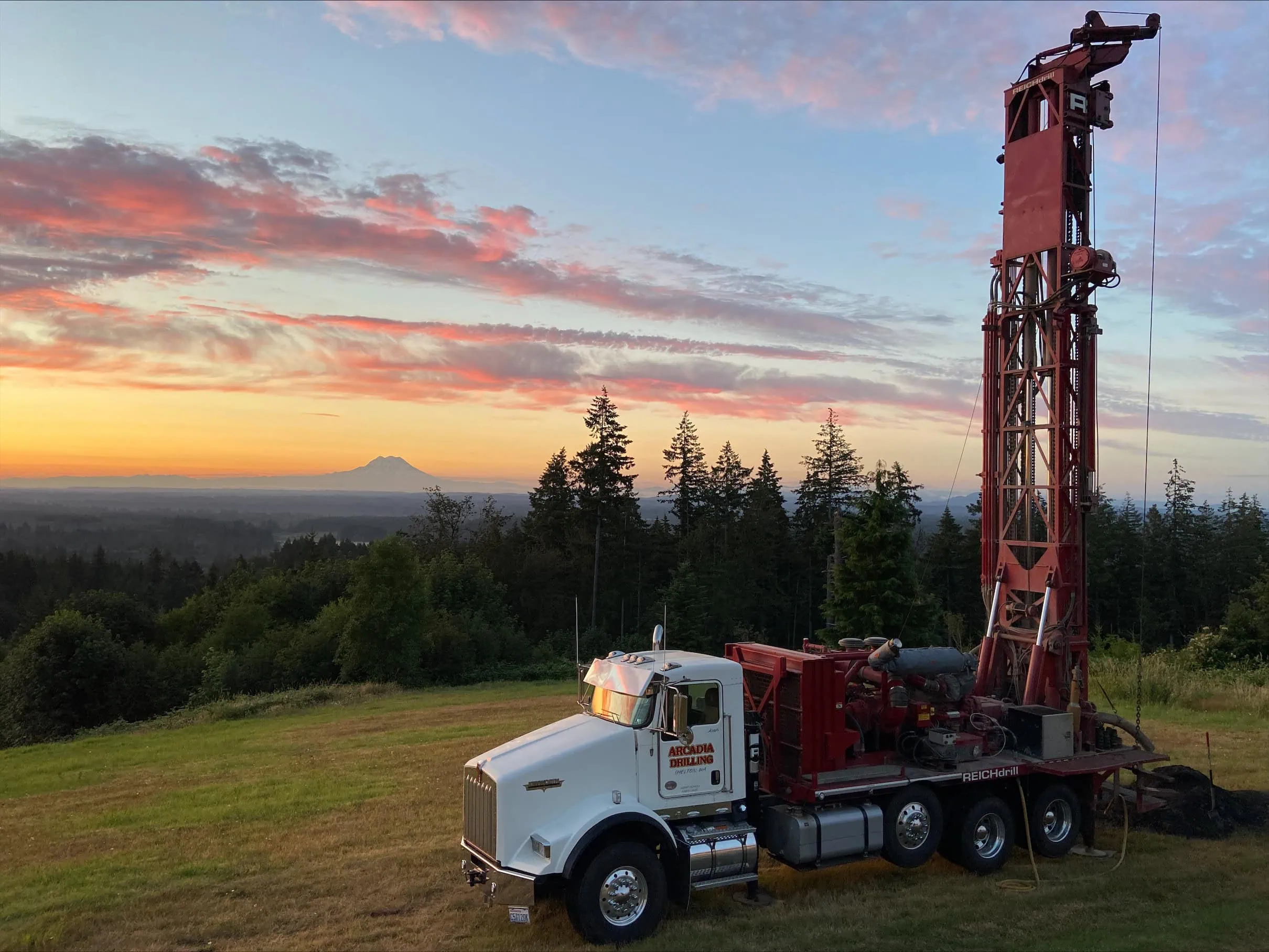 Arcadia Drilling rig on site at sunset